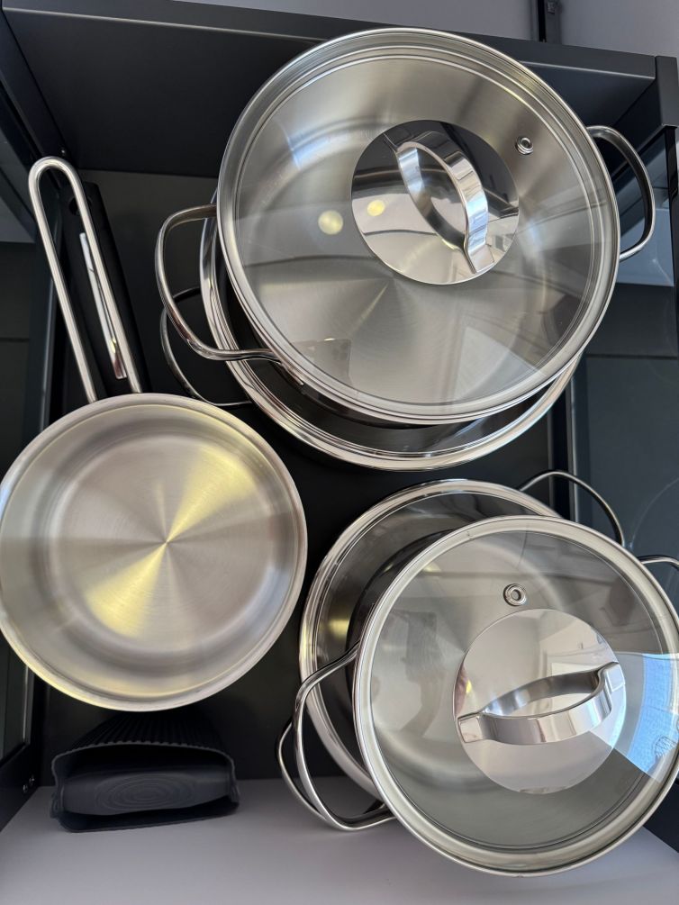 A selection of pots, pans, and an oven-safe baking tray