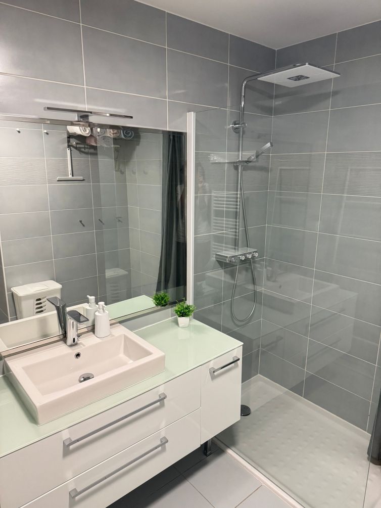 Spacious spa-style bathroom with touchless faucet