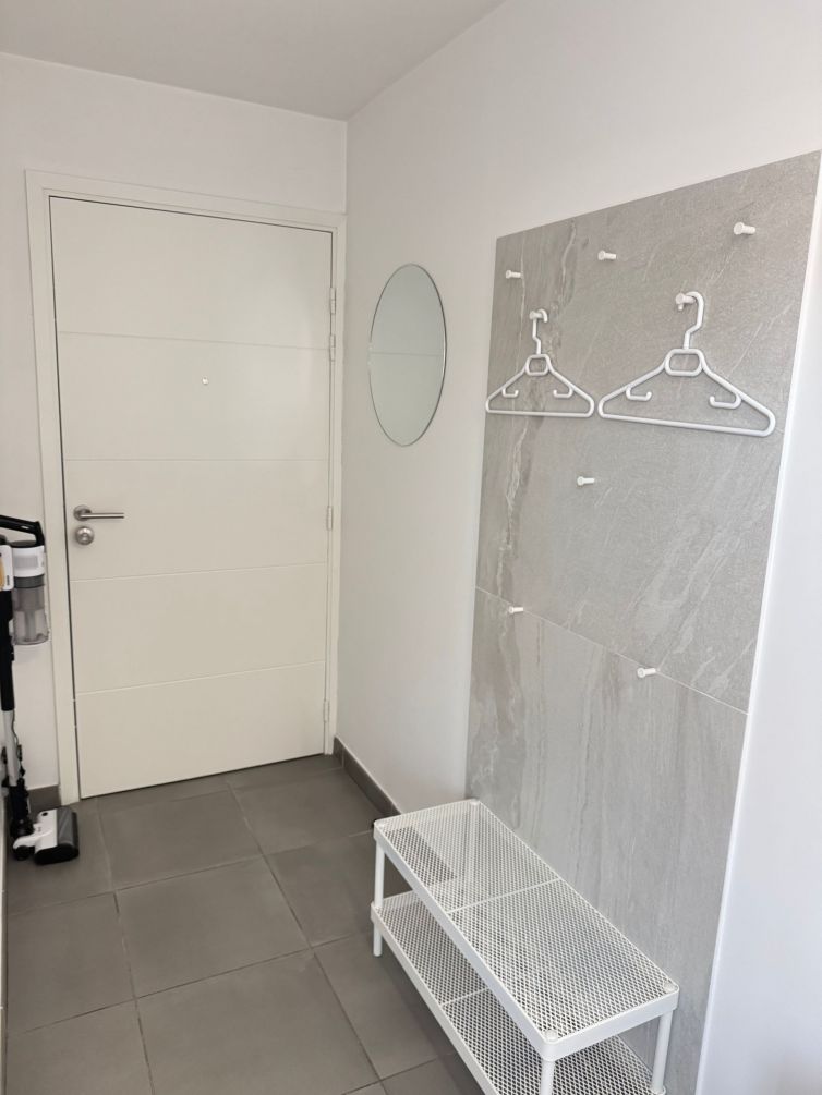 Entrance — smart lock, hat rack, shoe bench, vacuum cleaner, cabinet with children's books and games