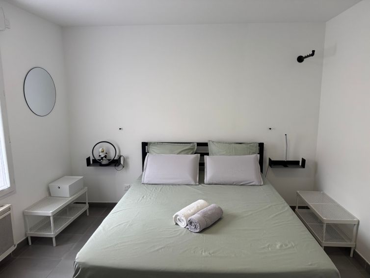 Clothes racks & door/wall hooks with numerous hangers, shoe benches, a wardrobe, and a desk drawer unit